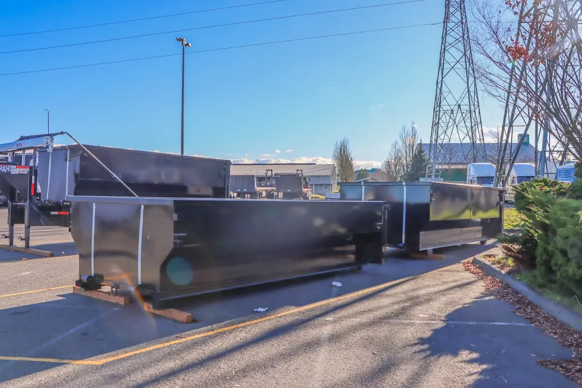 Roll-off dumpster ready for waste disposal at job site for Concrete Dumpster Rental in Columbia Falls